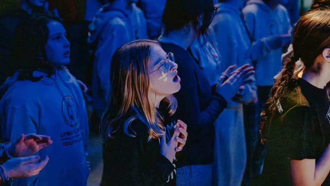 Young girl singing at church