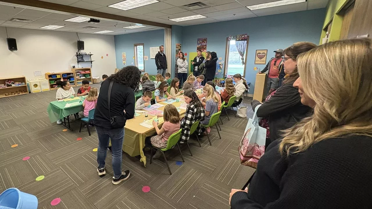 Children working on crafts together in classroom during church kids program